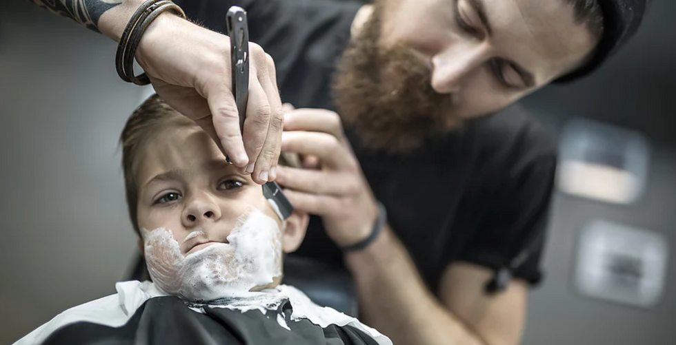 Barber shaving using a straight razor - shave soap - The Razor Company