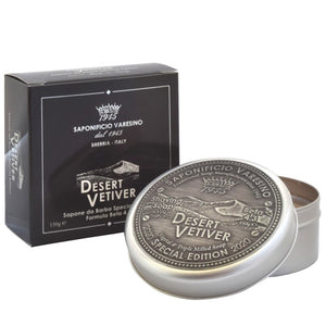 Desert Vetiver – Shaving Soap 150g Special Edition shaving soap scented with a Vetiver-inspired fragrance, with the addition in formula of Desert Date oil for a moisturizing and firming effect.  Scent Description A composition with warm and enveloping notes. The blend of Elemi, Incense, Orange and Artemisia flare up in the flowery, peppery, spicy heart. A multifaceted sillage of Black Pepper, Juniper Berries, Oregano and Lavandin swarms towards an elegant woody