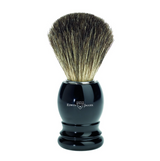 Edwin Jagger imitation ivory shaving brush. Features a lightweight moulded plastic handle and is filled with 100% pure badger hair. Use with a quality shaving cream or soap to create a rich shaving lather.   We recommend that after daily use shaving brushes are thoroughly rinsed in warm water and hung to dry in a stand. Presented in Edwin Jagger branded packaging.  Dimensions: Overall height 103mm  Handle height 52mm  Handle diameter 33mm  Knot size 21mm Weight 36g