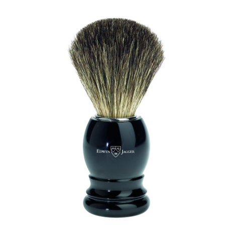 Edwin Jagger imitation ivory shaving brush. Features a lightweight moulded plastic handle and is filled with 100% pure badger hair. Use with a quality shaving cream or soap to create a rich shaving lather.   We recommend that after daily use shaving brushes are thoroughly rinsed in warm water and hung to dry in a stand. Presented in Edwin Jagger branded packaging.  Dimensions: Overall height 103mm  Handle height 52mm  Handle diameter 33mm  Knot size 21mm Weight 36g